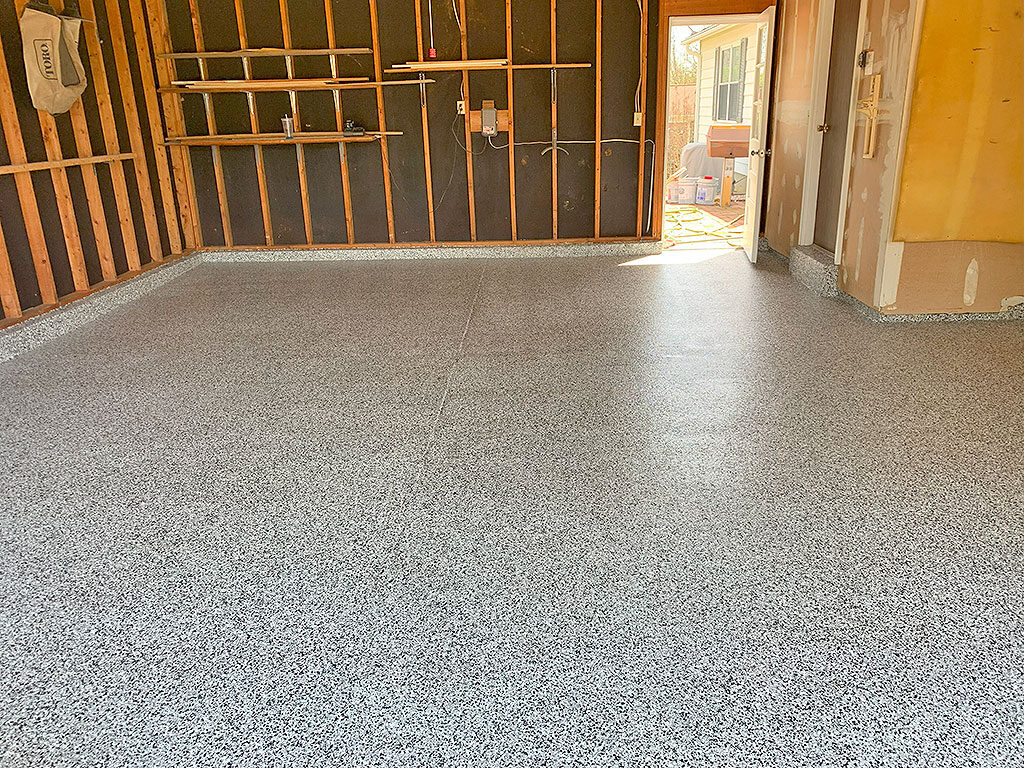 Gray epoxy floor in a working garage