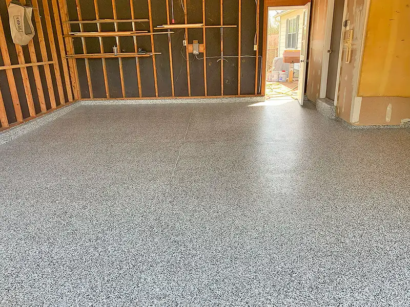Gray epoxy floor in a working garage