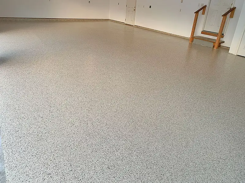 Polyaspartic coated tan garage floor