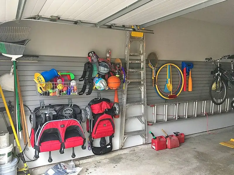 Slatwall panels organizing bikes, tools and family gear