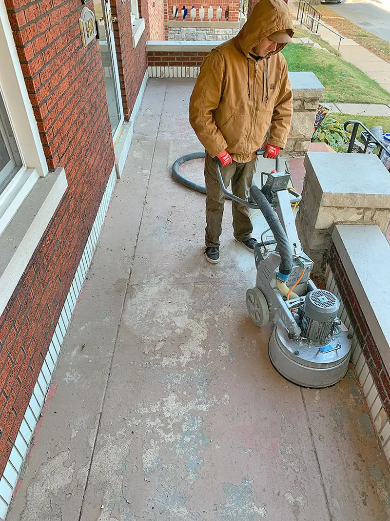 Technician diamond grinding a concrete floor
